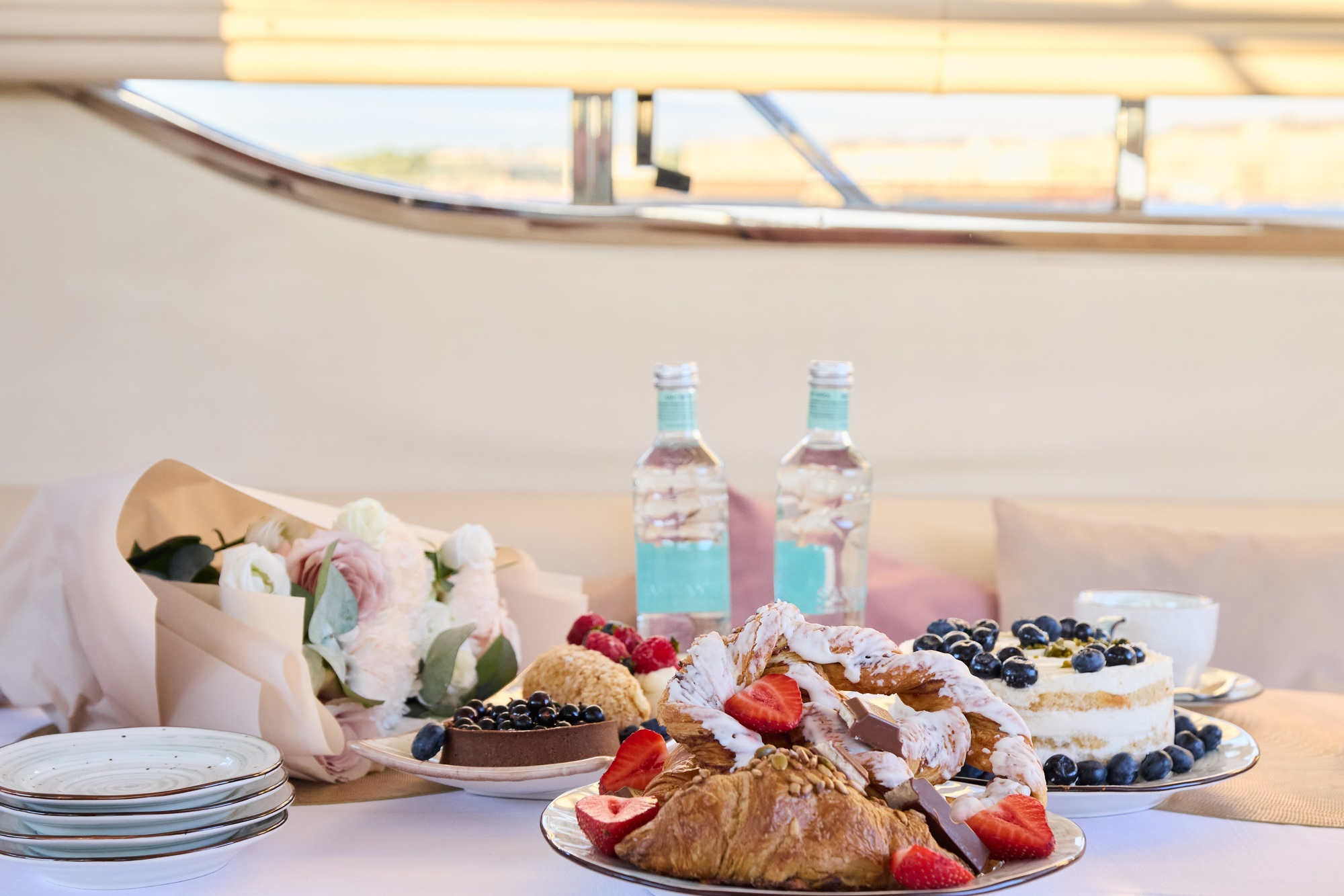 Enjoy a beautiful yacht brunch with a variety of delicious treats in an elegant setup